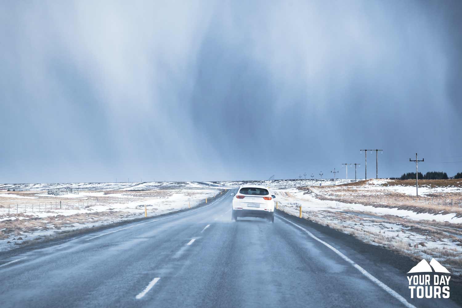 car on snowy ring road