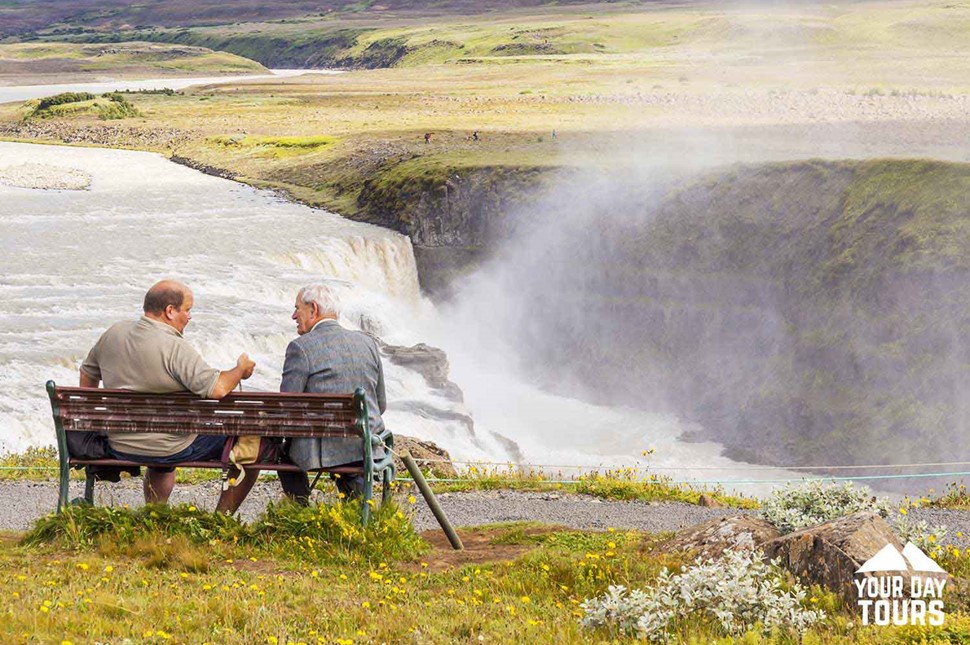 old men sitting by gullfoss in iceland 
