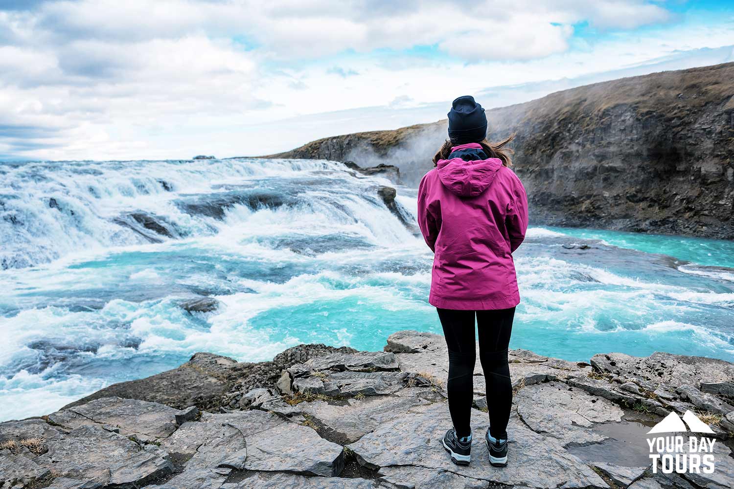 person sighseeing gullfoss waterfall