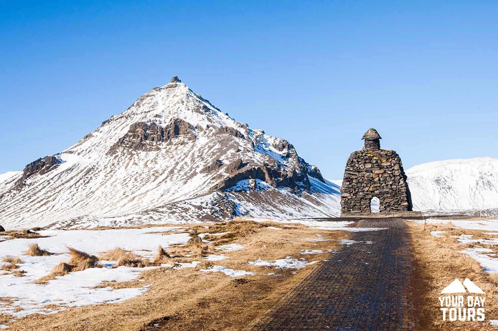 winter stone statue monument in iceland