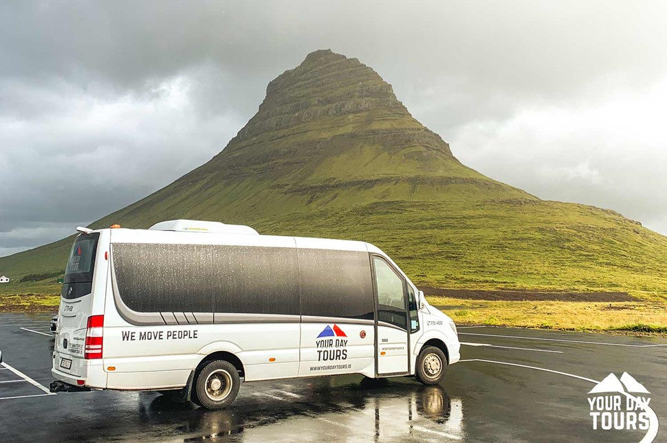 minibus in front of kirkjufell in iceland