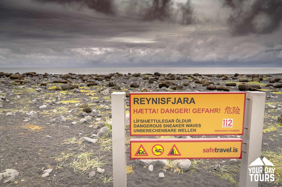 warning sign in reynisfjara black sand beach