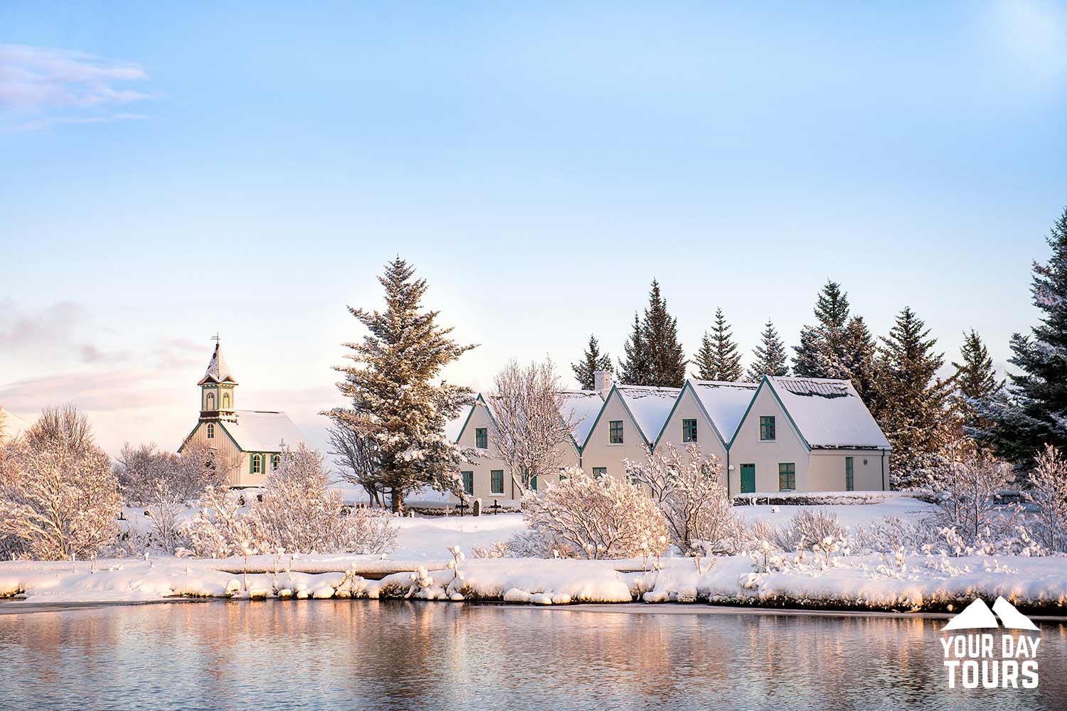 view of a church by the lake in iceland