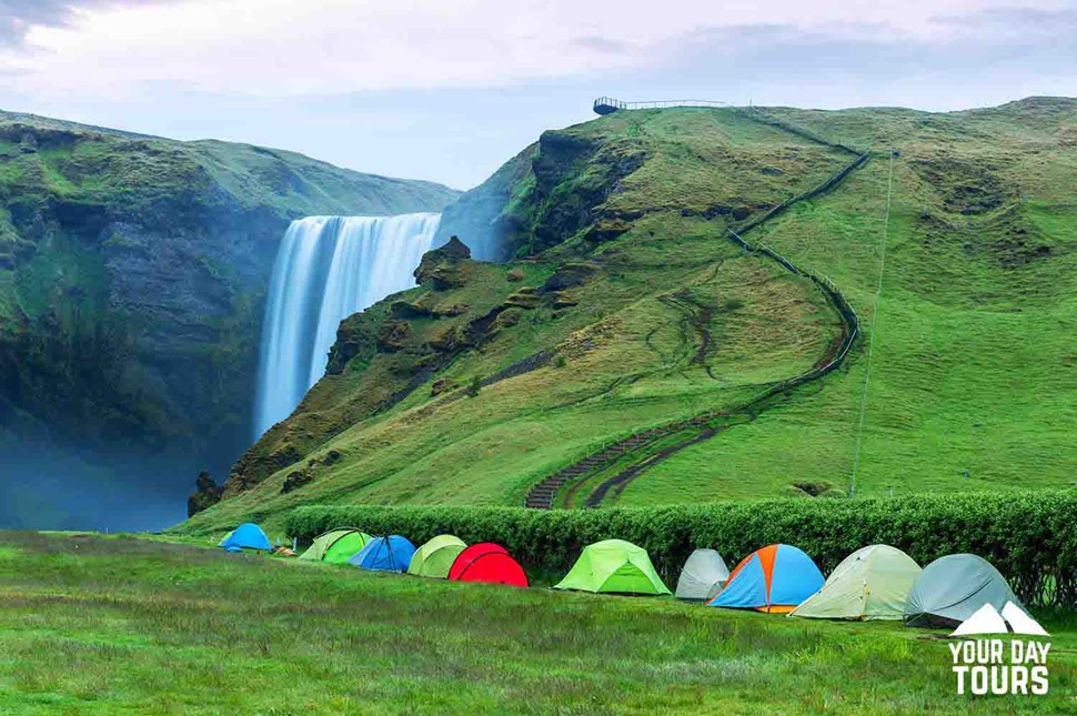 tents in a green field in iceland