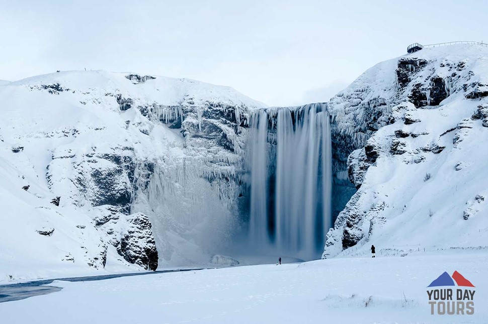 winter snowy view of skogafoss waterfall in south coast 