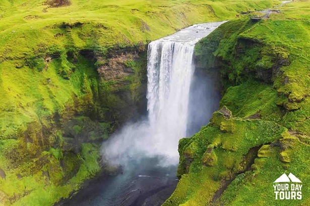aerial summertime view of skogafoss waterfall in south iceland