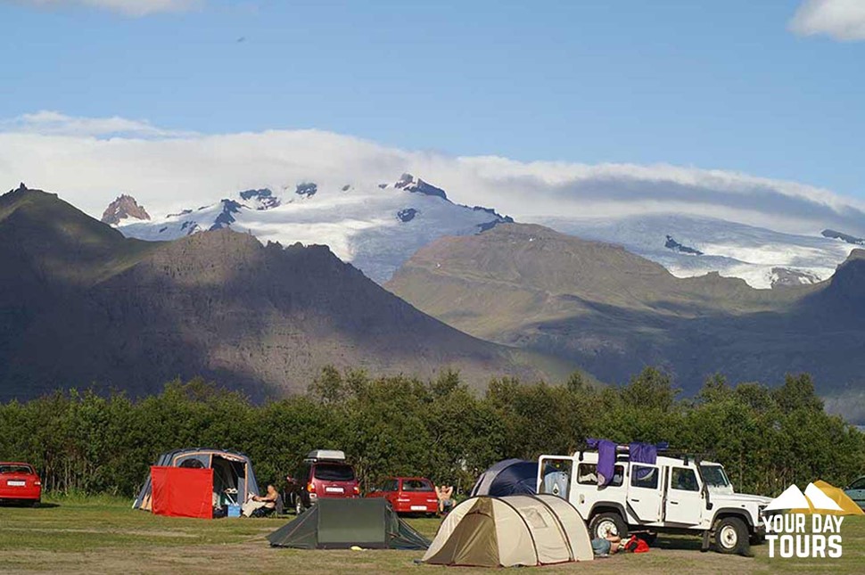 cars and tents at the campsite 