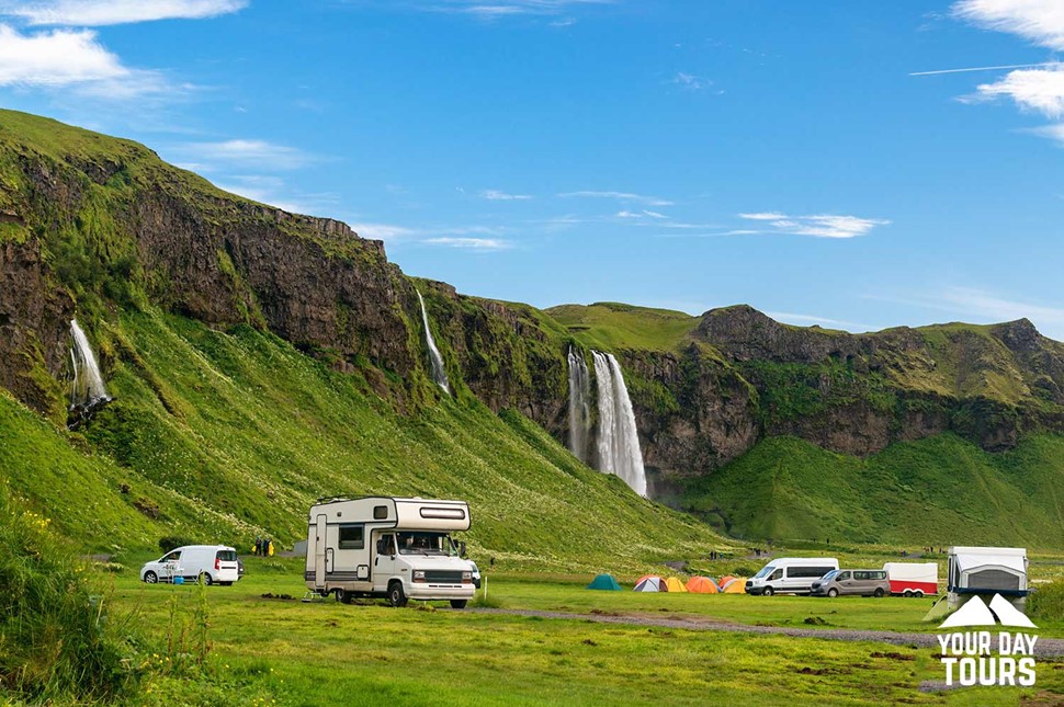 camping van by seljalandsfoss waterfall