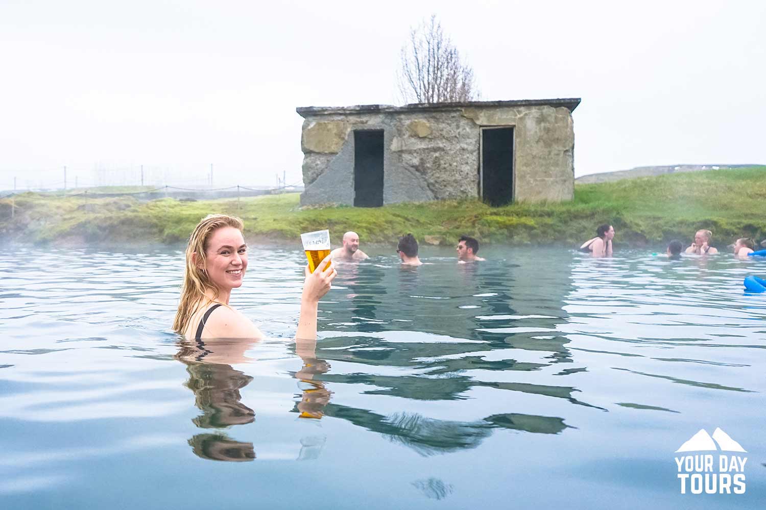 happy woman bathing in iceland 