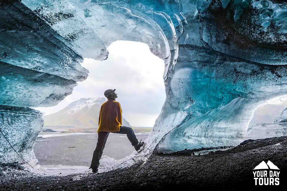 woman inside a cave in iceland 