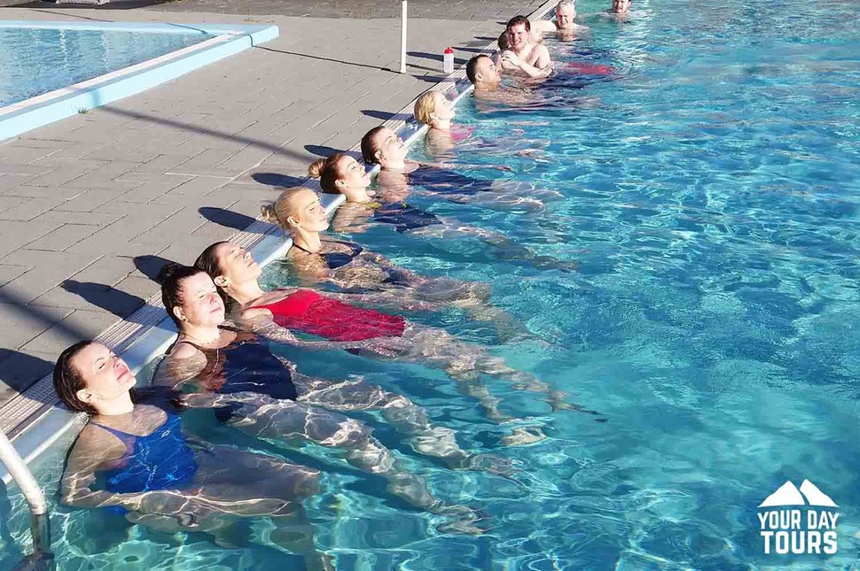 people relaxing in the swimming pool