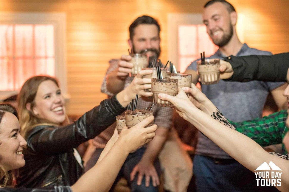 friends celebrating at a pub bar 