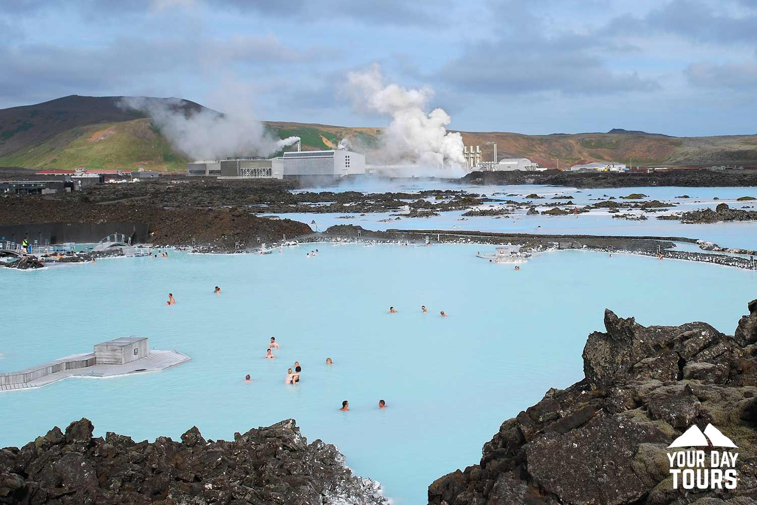 many people bathing in blue lagoon