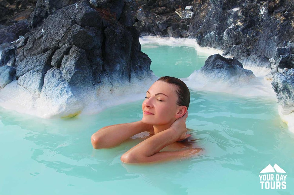 happy woman relaxing at blue lagoon 