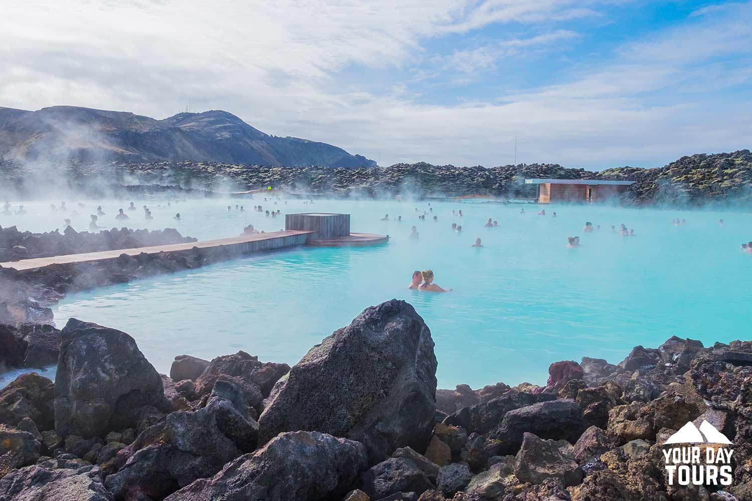 people enjoying geothermal pool