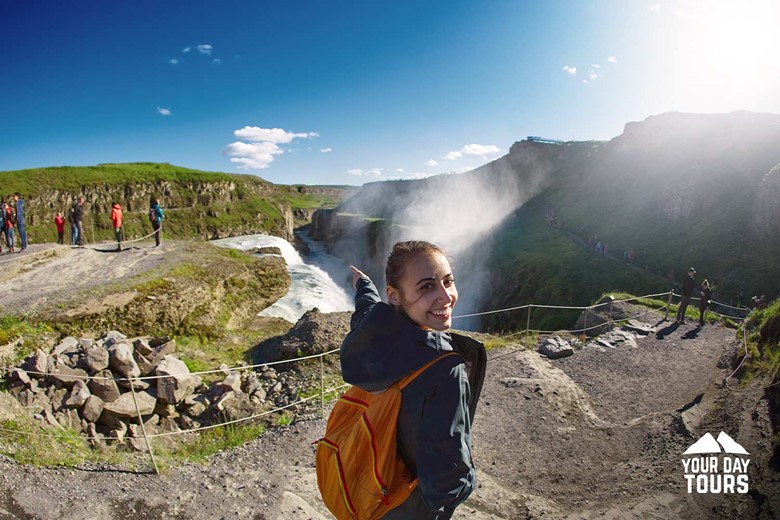 Excited Woman at Gullfoss Waterfall in Iceland