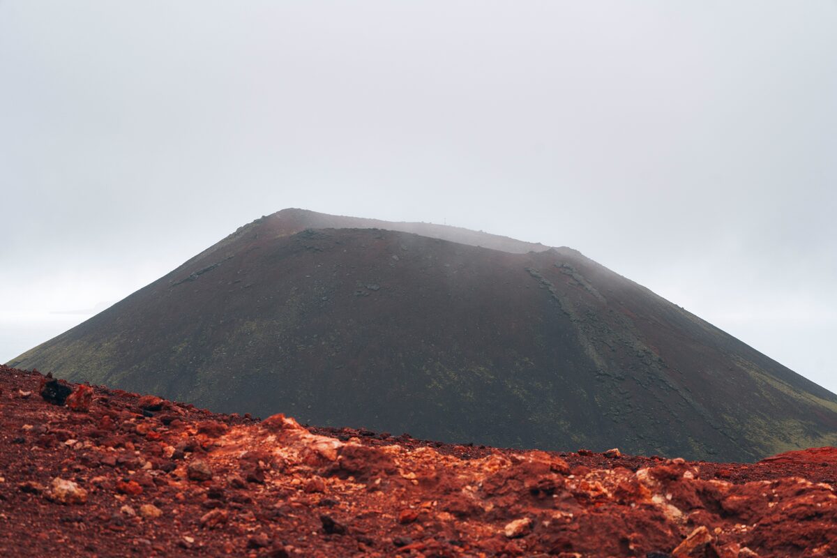 Red lava field near volcano in Iceland